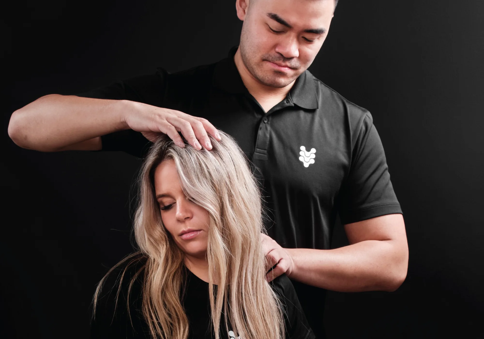 A practitioner assessing the neck of a client