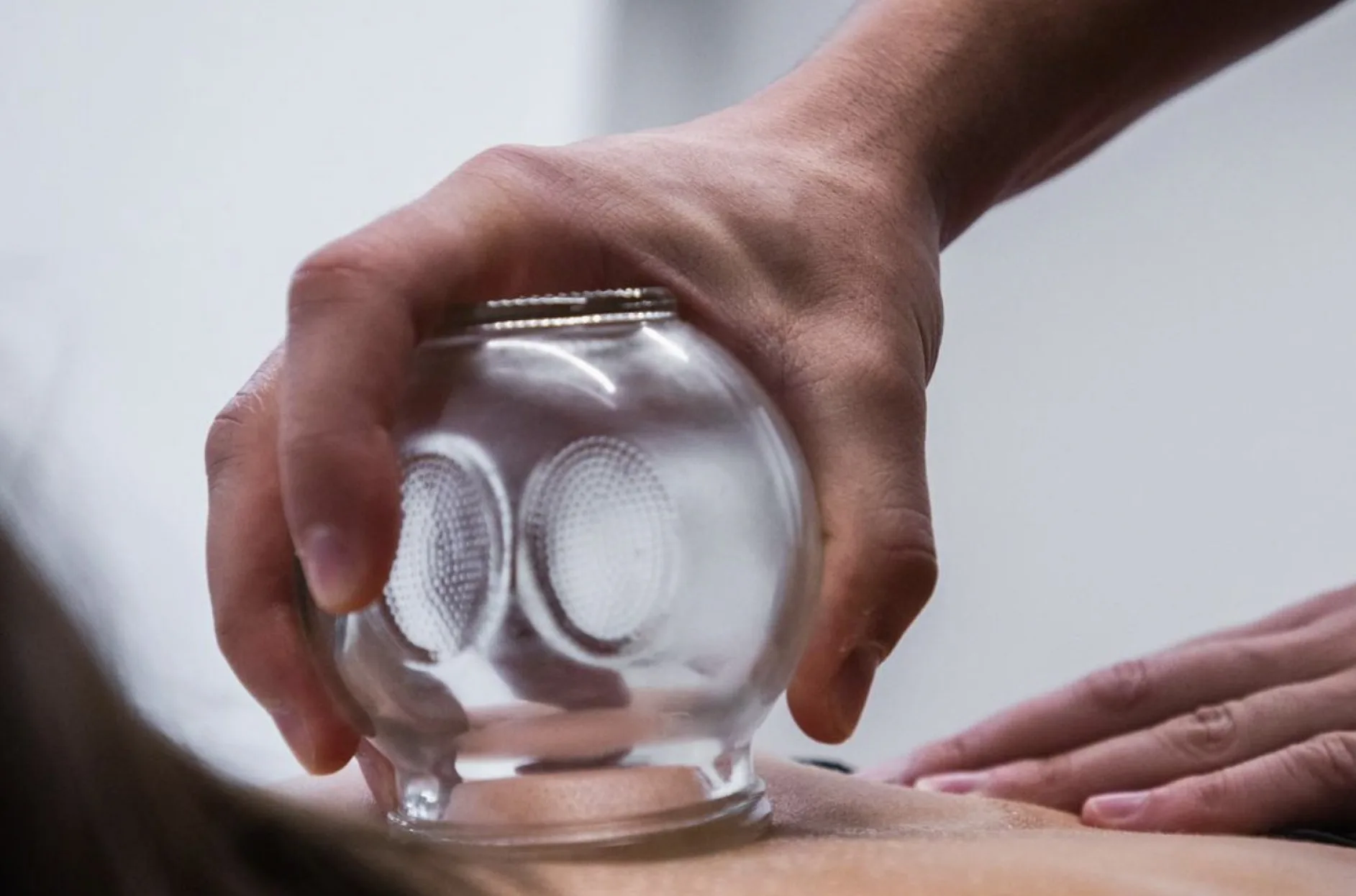 A practitioner assessing a client at The Spinal Studio